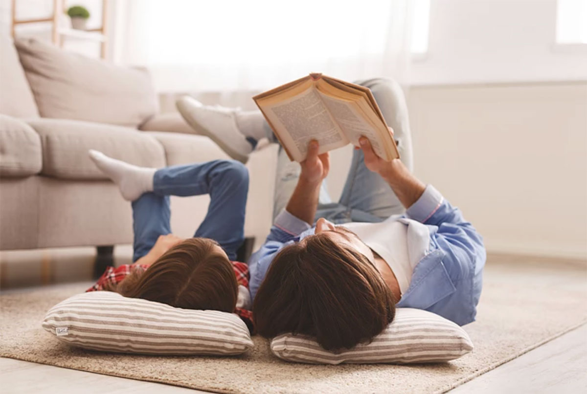 child and parent reading together