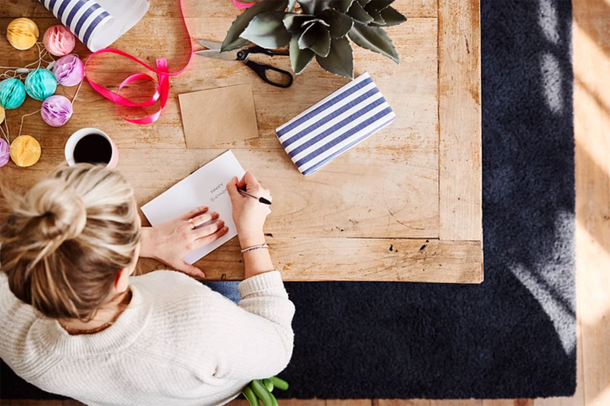 woman writing a note