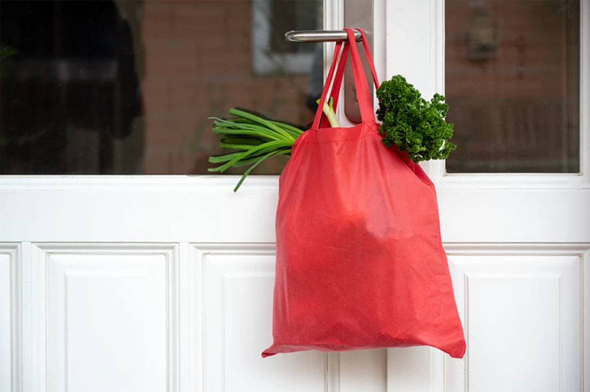 shopping bag handing on door handle