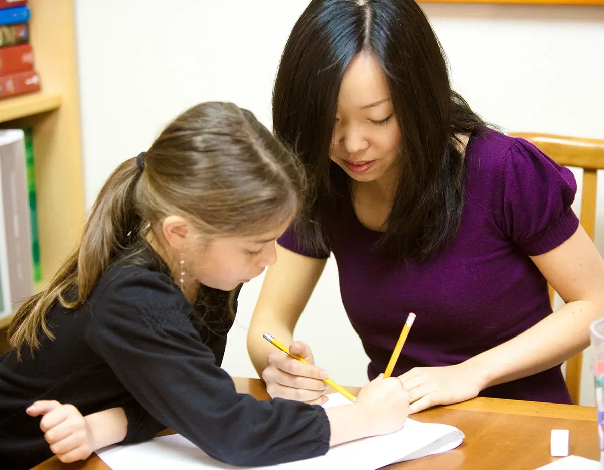 tutor and student working on homework